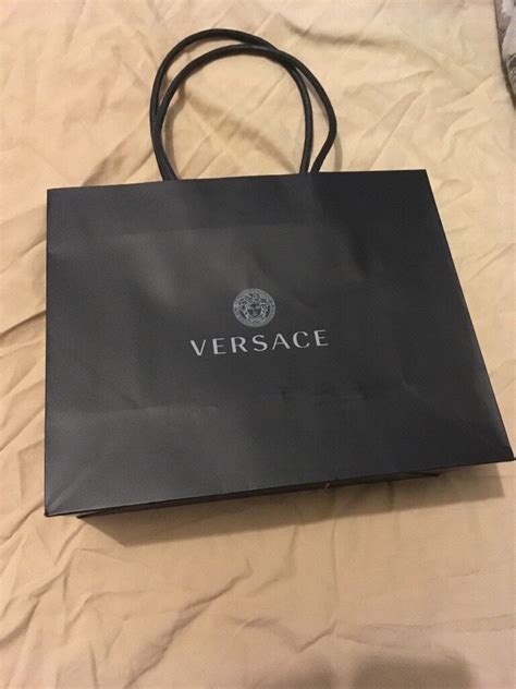 versace paperclip trainers|Versace pink shopping bag.